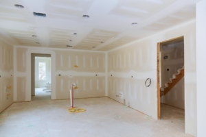 Drywall is hung in kitchen remodeling project Interior of apartment with materials during on the