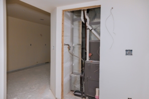 New home construction with installation of heating system in basement of house under remodeling
